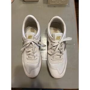 New Balance cream and gold sneakers casual glam